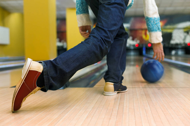 Man throw ball at bowling lane, cropped image - Photo, Image