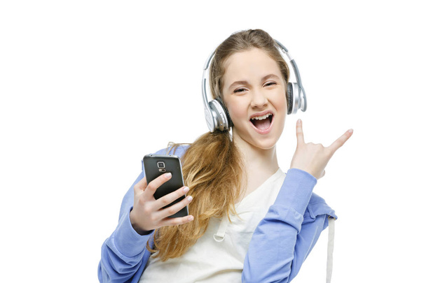 Tiener leeftijd meisje met koptelefoon - Foto, afbeelding