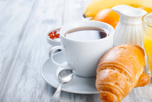 Traditional breakfast croissant, and coffee, jam ,orange juice - Фото, изображение