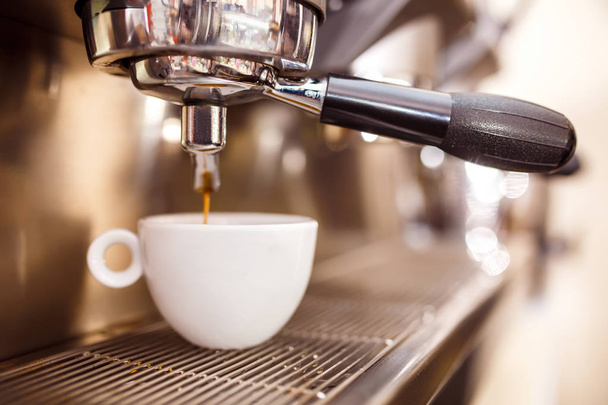 Espresso being prepared from coffee machine.  - Photo, Image