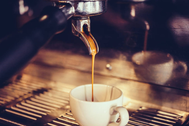 Coffee pouring into a cup - Foto, imagen