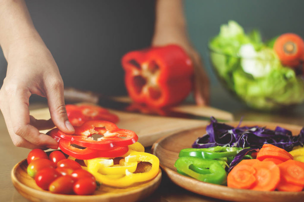 Woman holding red bell peppers. Cooking vegan food. healthy  wit - Fotoğraf, Görsel