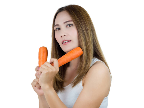 Asian Woman holding carrot, isolated on white background. Healthy Food concept. - Valokuva, kuva