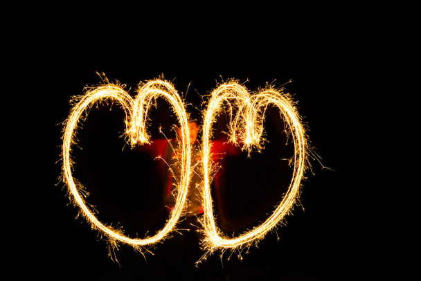 Sparklers heart, Using a camera with a slow shutter speed - Photo, image