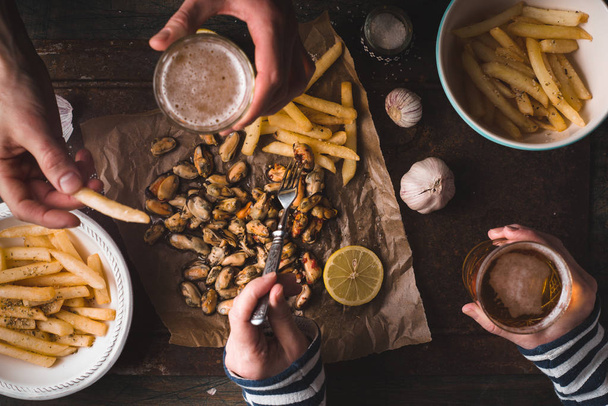 Feast with beer, mussels, fried potatoes - Zdjęcie, obraz