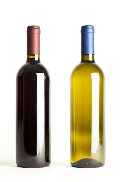 Red and white wine bottles on white background - Photo, image