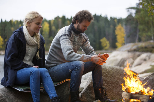 Couple Warming Themselves By Bonfire - Photo, Image