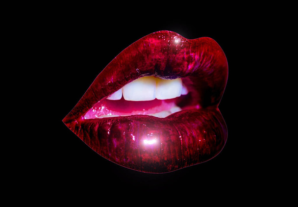 Glossy luxury lips close up isolated on black background. Shiny lips of girl with white teeth and sensual pink tongue. Dark red lipstick and sexy kiss. Cosmetics concept, isolated lips with lipstick - Photo, Image