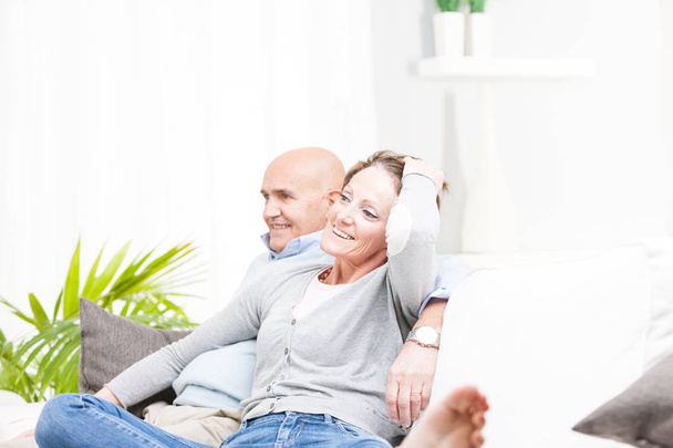 Happy romantic couple watching television - Photo, Image