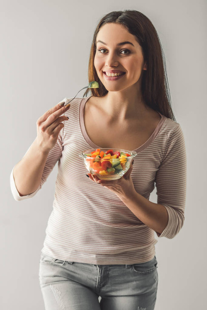 Attractive girl with food - Фото, зображення