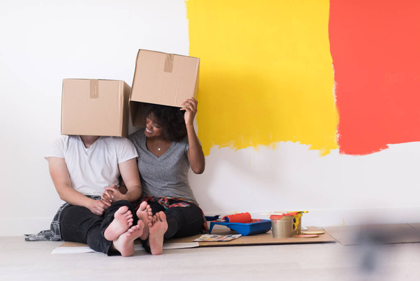 couple playing with cardboard boxes - Fotó, kép