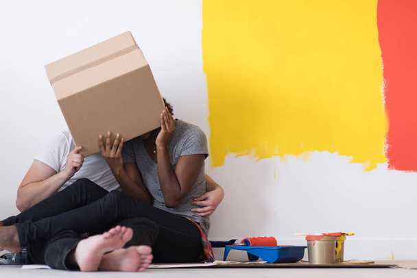 couple playing with cardboard boxes - Фото, зображення