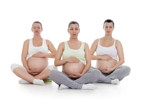 Pregnant women doing breathing exercise - Photo, Image