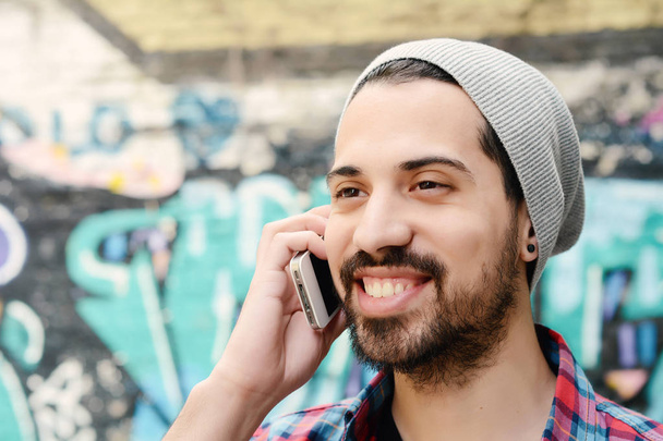 Latin man talking on the phone - Photo, image