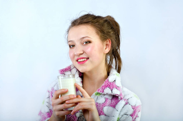 beautiful girl in pajamas with milk - Fotó, kép
