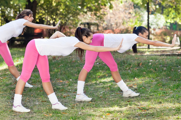 Young women stretching - Foto, imagen