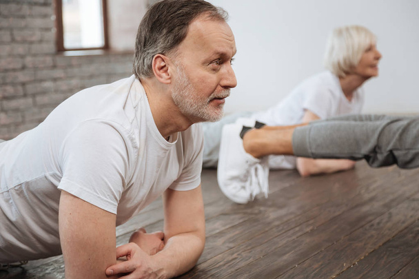 Portrait of aged  people  doing exercises - Foto, afbeelding