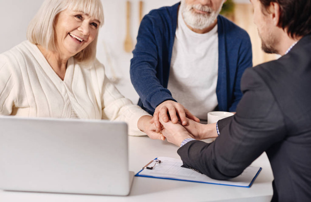 Real estate agent working with elderly couple  - Foto, immagini