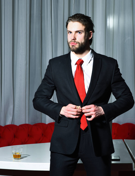 bearded man, businessman with glass of whiskey, cell phone - Zdjęcie, obraz
