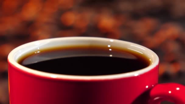 Last drop of coffee falls into the drink. Slow motion - Felvétel, videó