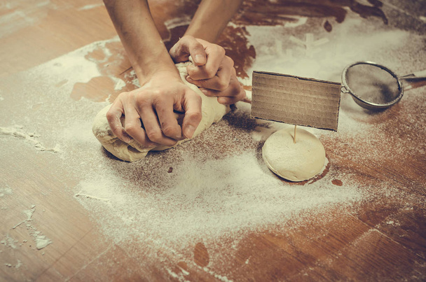 Female hands pressing dough  - Photo, Image