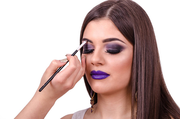  girl doing make up - Фото, изображение
