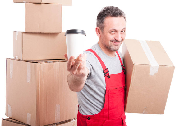 Mover man holding box and showing coffee - Photo, Image