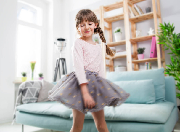 Cute little child girl dancing at home - Foto, afbeelding