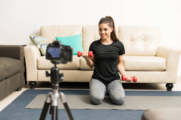 Cute fitness blogger giving some advice - Valokuva, kuva