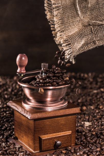 Coffee mill with coffee beans - Фото, зображення