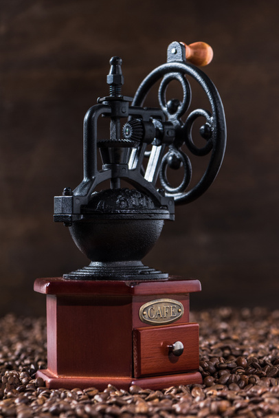 Coffee mill on coffee beans - Photo, Image