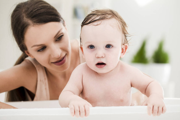 Mother Bathing Her Baby - Photo, Image