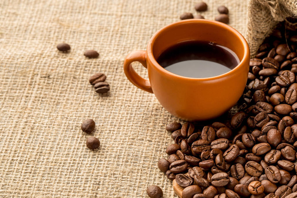 Cup of coffee on burlap background - Zdjęcie, obraz