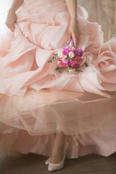 bride in wedding dress holding bouquet - Photo, image