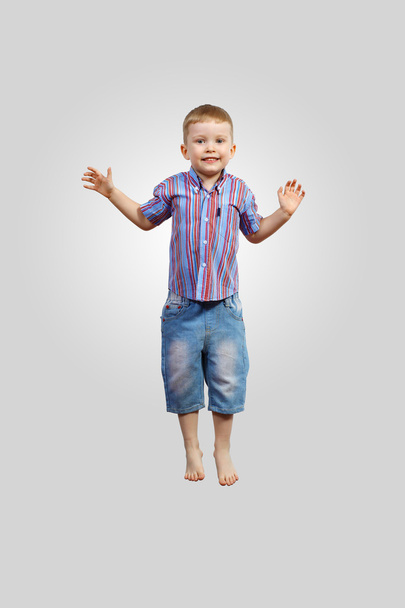 Happy kid jumping - Фото, изображение