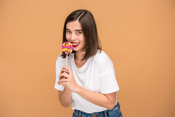 The young woman with colorful lollipop - Foto, imagen