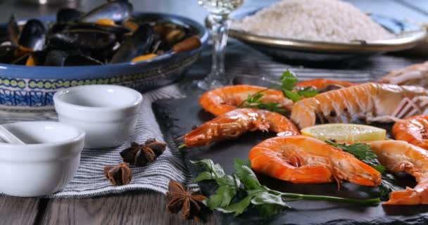 Ingredients for a Spanish seafood paella: mussels, king prawns, langoustine, haddock - Footage, Video