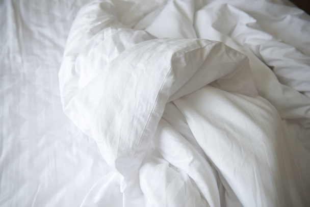 messy blanket on bedding - Фото, изображение