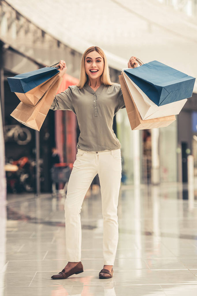 Attractive girl going shopping - Фото, изображение