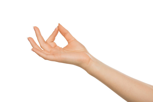 Mano femenina mostrando gesto de recoger, recorte
 - Foto, Imagen