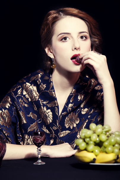 Portrait of beautiful rich women with grapes. - 写真・画像
