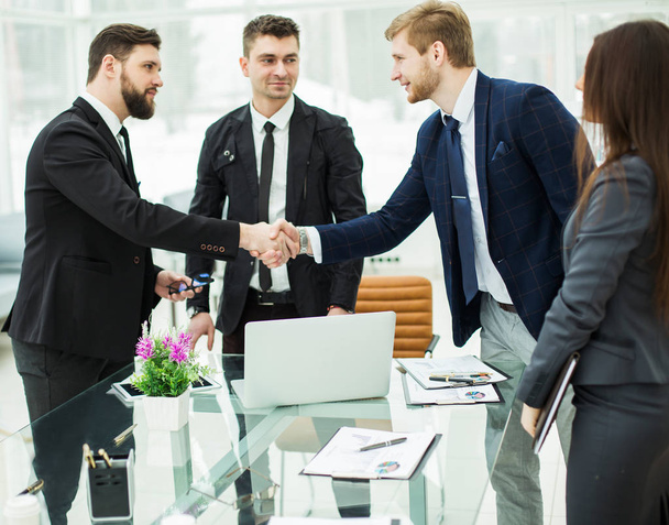 handshake of the Manager and the client prior to conclusion of contract in a modern office - 写真・画像