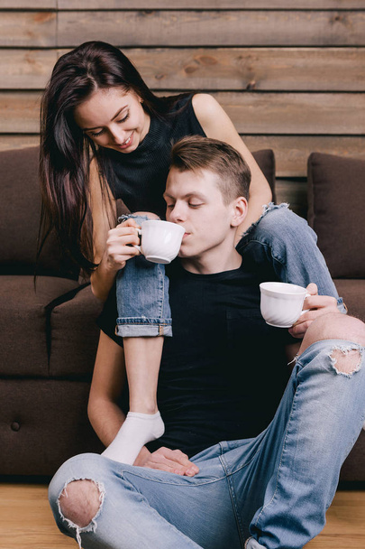 beautiful girl is drinking a guy with tea - Zdjęcie, obraz