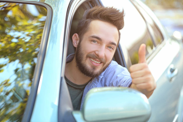 young man sitting in car - Photo, image