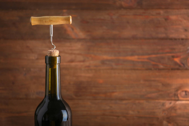 Wine bottle with corkscrew  - Foto, imagen