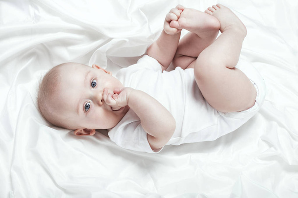 Happy little baby lying. - Valokuva, kuva