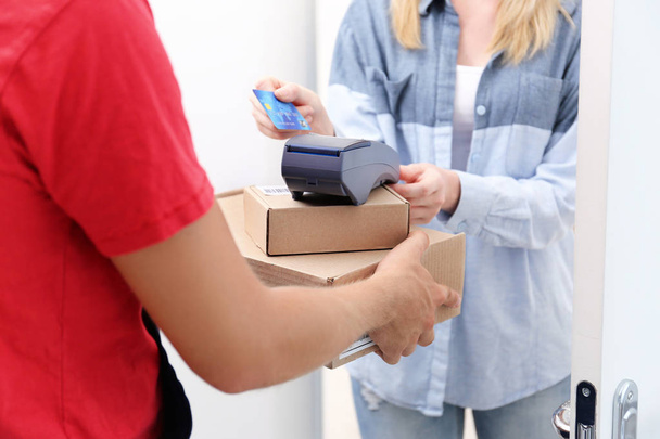 woman paying for package  - Photo, image