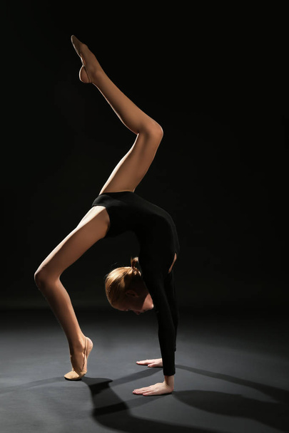 Young girl doing gymnastic exercise - Фото, изображение