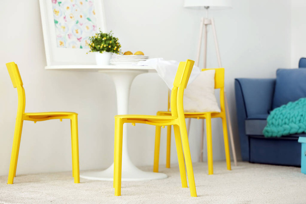 room interior with yellow chairs - 写真・画像
