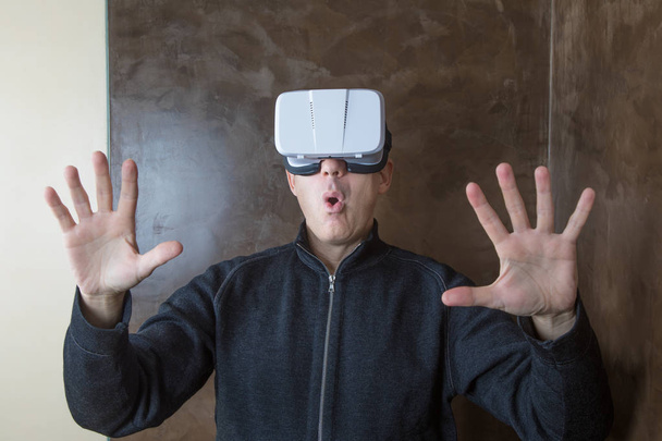 man with VR glasses surprised gesture - Photo, Image